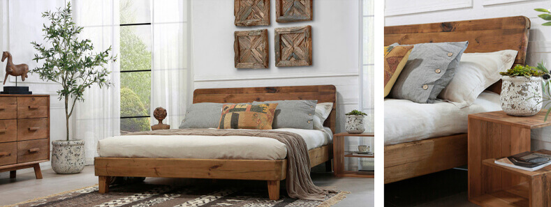Rustic bedroom with white walls, light wood floors and wooden bed, pedestal and chest of drawers agains